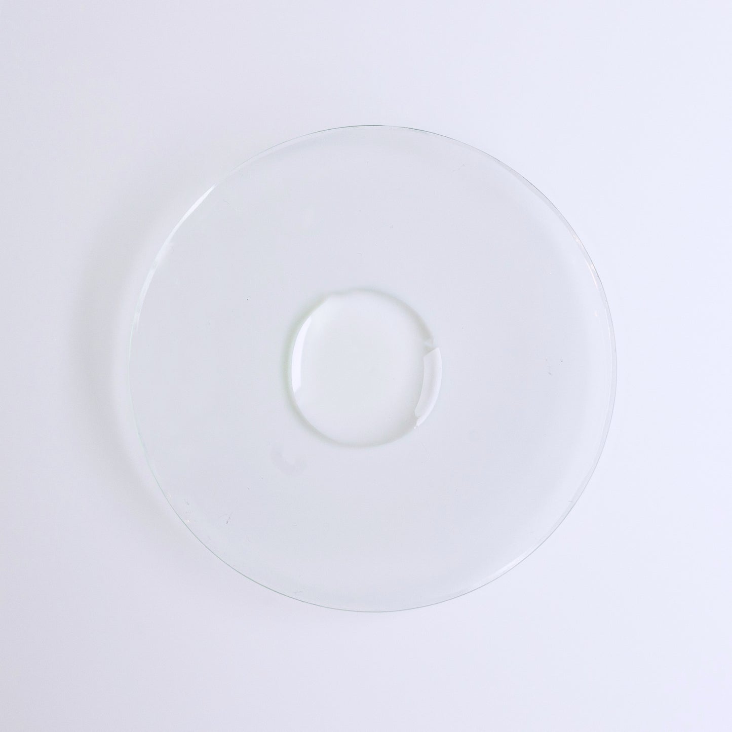 I WOKE UP LIKE THIS Beyond-hydration Perfecting Serum, water face serum, single drop of clear liquid on a glass dish.