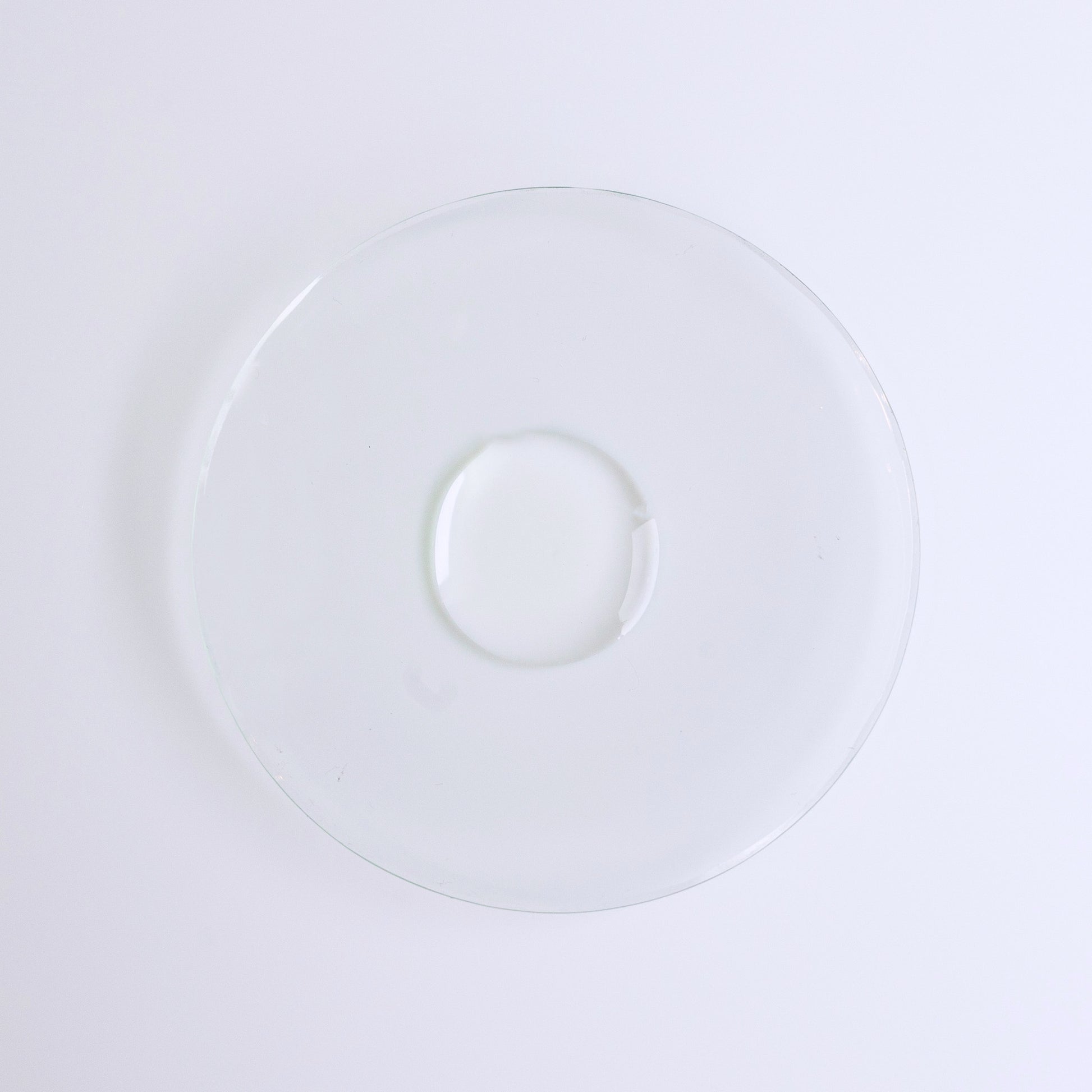 I WOKE UP LIKE THIS Beyond-hydration Perfecting Serum, water face serum, single drop of clear liquid on a glass dish.