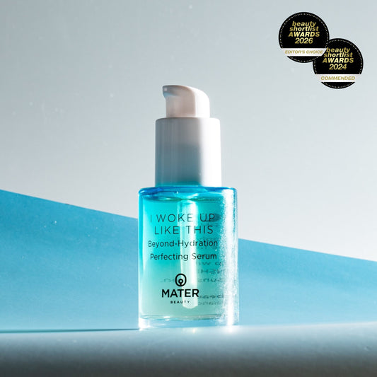 MATER Beauty I WOKE UP LIKE THIS Beyond-Hydration Perfecting Serum bottle on a black background with dramatic lighting and Beauty Shortlist Award 2006 Badges