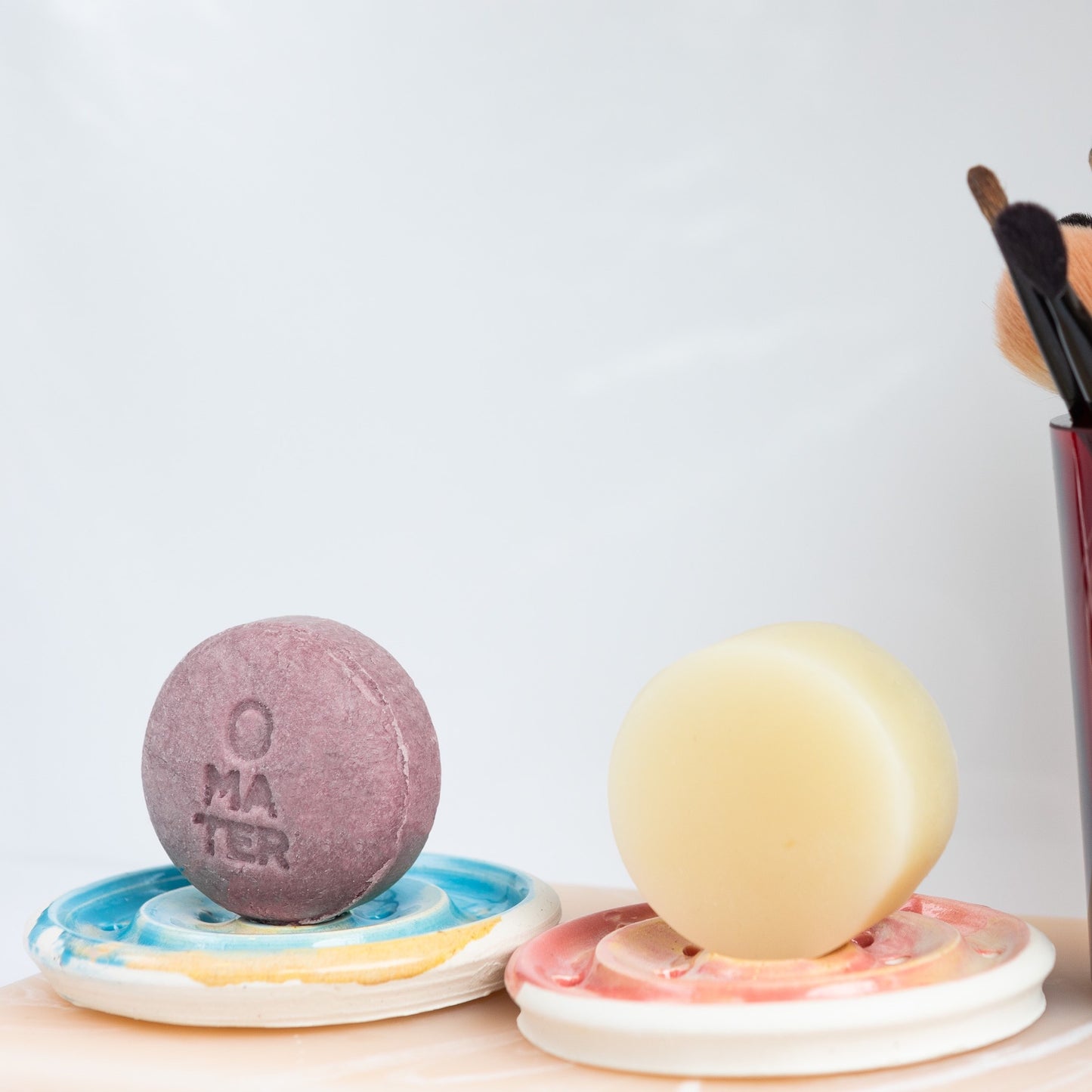 Oka Pottery ceramic dishes with a soap bar and a conditioner bar