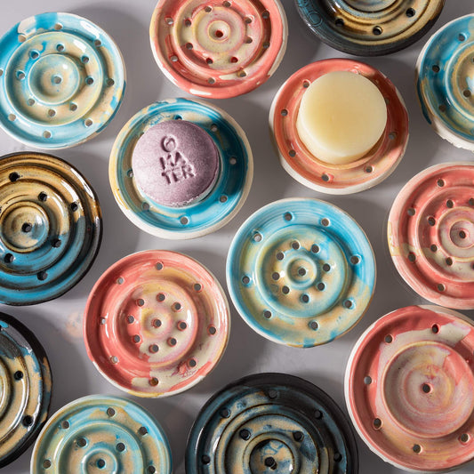 Many Oka Pottery ceramic soap dishes for shampoo bars and solid conditioner